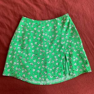 Green miniskirt with black and white flowers